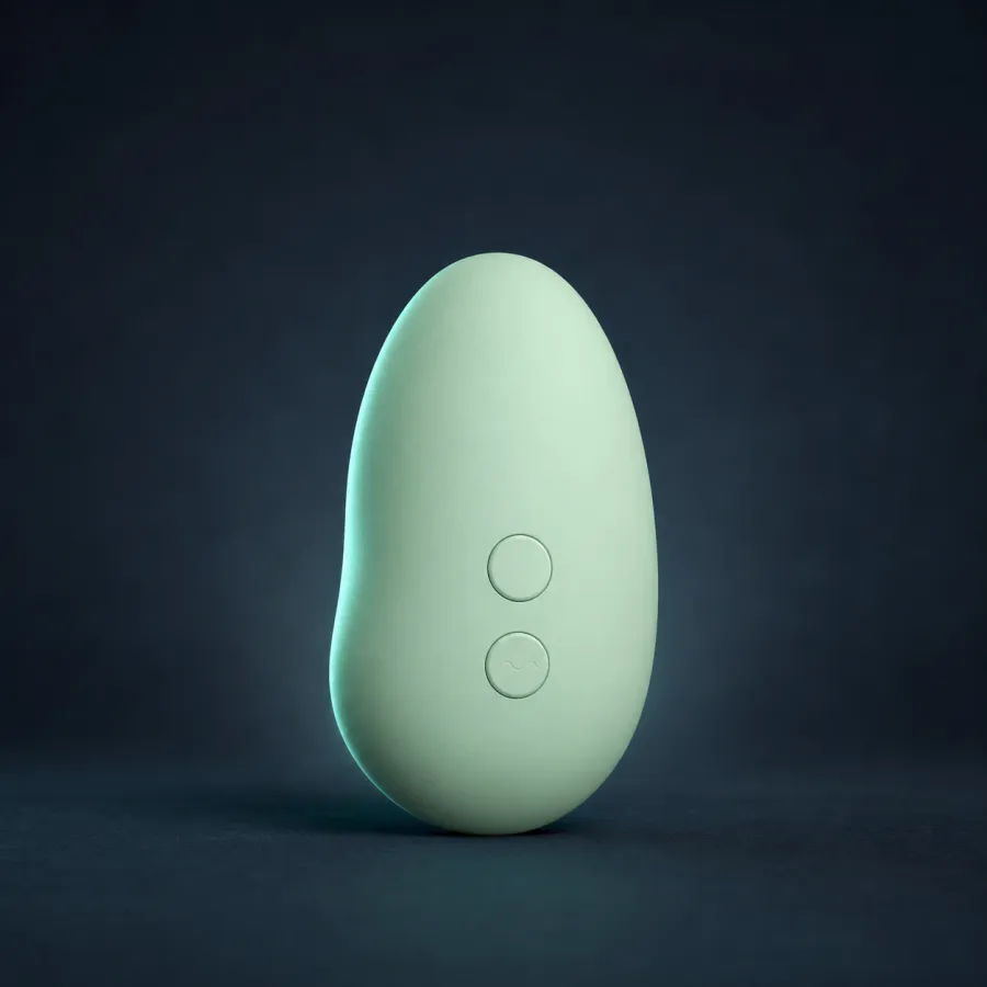 Mint palm-sized personal massager on a navy background